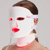 Aesthifae red light therapy mask on the face for at-home rejuvenation.
