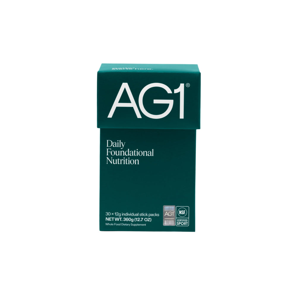 AG1 classic formula powder scoop for daily nutrition and gut support.