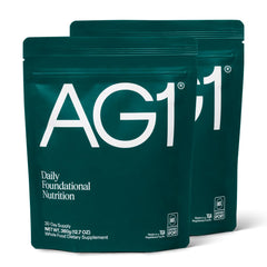 AG1 Classic Formula tub with scoop for daily nutritional coverage.