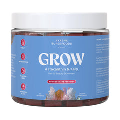 Akasha Grow Hair & Beauty Gummies bottle on countertop, plant-based formula