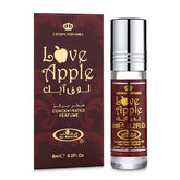 Al-Rehab Love Apple bottle pour highlights a crisp green apple opening for a fresh daily wear