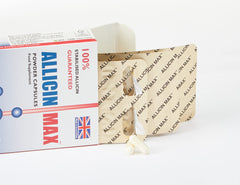 Close-up of AllicinMax capsules highlighting vegan, easy-to-swallow design.
