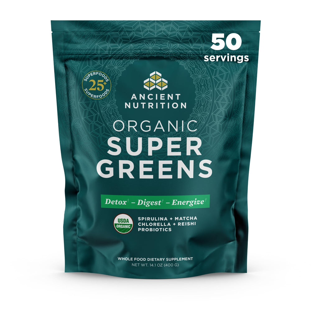 Ancient Nutrition Super Greens powder bottle on kitchen counter with probiotics