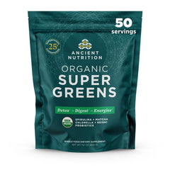 Ancient Nutrition Super Greens powder bottle on kitchen counter with probiotics