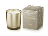 APOTHEKE Firewood candle in a brown jar for warm, lasting home fragrance.