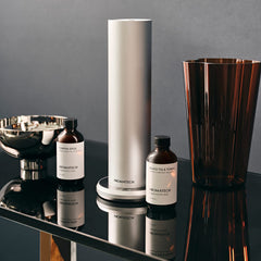 AromaTech Pumpkin Spice diffusing mist in a room creating cozy ambiance.