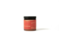 Hands applying As I Am Curling Creme for frizz control and curl shaping