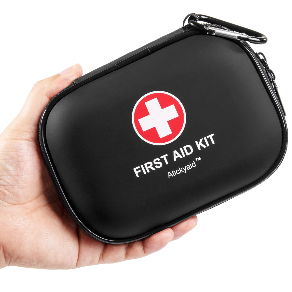 Atickyaid mini first aid kit in a compact case for travel readiness.