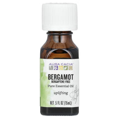 Aura Cacia Bergamot oil bottle pour for uplifting diffusers and DIY blends.