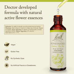 Close-up of Honeysuckle dropper releasing drops for daily emotional balance.