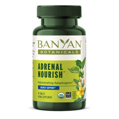 Banyan Botanicals Adrenal Nourish bottle on a neutral surface for daily energy support.