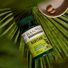 Outer packaging of Banyan Botanicals Haritaki emphasizes sustainable sourcing.