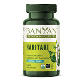 Banyan Botanicals Haritaki tablets on a clean surface for daily digestive wellness.