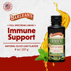 Pouring Barlean's olive leaf liquid into a glass for daily use.