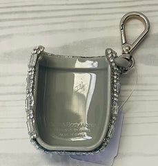 PocketBac holder attached to a bag for portable sanitizer access.