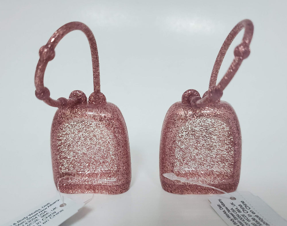 Bath & Body Works PocketBac holder in Sparkled Pink keeps sanitizer handy for on-the-go use.