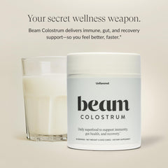 Close-up of the Beam Colostrum Powder jar showing a 3g serving for recovery.
