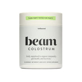Beam Colostrum Powder bottle with scoop highlights immune support and gut health.
