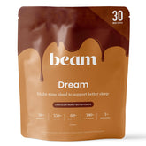 Beam Dream Sleep Powder bottle on nightstand suggesting calm evening routine.