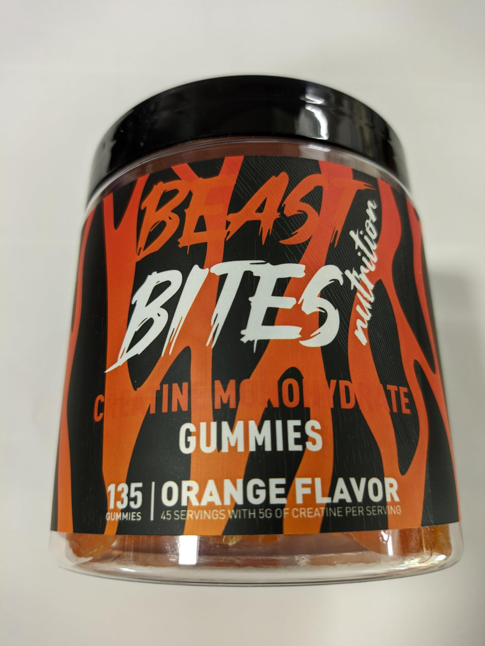BEAST BITES Creatine Monohydrate Gummies orange bottle for convenient pre- or post-workout support.