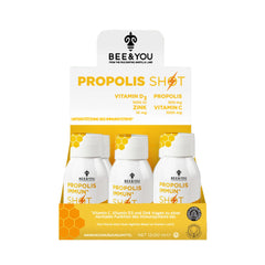 Bee & You Immune Shot bottle on a bright counter, supports daily wellness with antioxidants.
