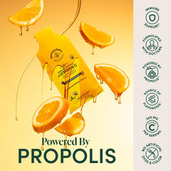 Beekeeper's Naturals kid immune sachet being squeezed into a drink for easy dosing.