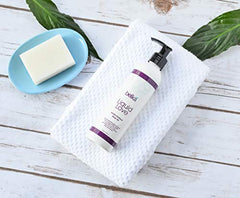 Belká Liquid Love Vanilla Exotique bottle being opened for a silky massage