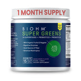 BIOHM Super Greens bottle on kitchen counter showing the brand for daily gut-friendly nutrition.