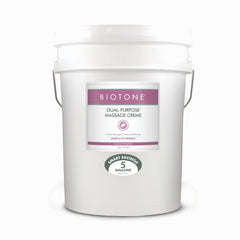 BIOTONE Dual-Purpose Massage Crème bottle offering effortless glide for massage sessions.