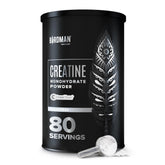 Birdman micronized creatine bottle closeup showing vegan, gluten-free formula for workouts.