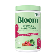 Bloom Nutrition Greens Powder bottle highlighting spiced cranberry flavor and digestive comfort