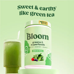 Bloom Nutrition greens powder scoop ready to mix into smoothies.