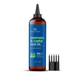 Botanic Hearth rosemary castor hair oil bottle pour showing convenient dosing for scalp care