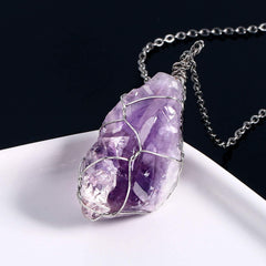 BoutiqueLovin amethyst crystal necklace closeup showing vivid purple facets.