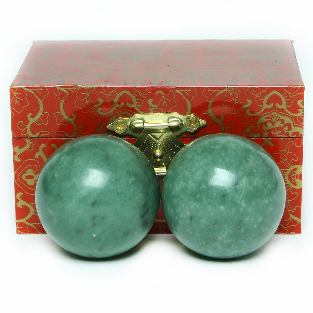 Brass Statu BRABUD 1.57-inch marble green Baoding ball pair close-up texture for focus.