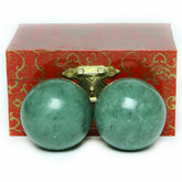 Brass Statu BRABUD 1.57-inch marble green Baoding ball pair close-up texture for focus.