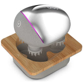 Breo Portable Mini Scalp Massager in silver with base delivers compact scalp relaxation.