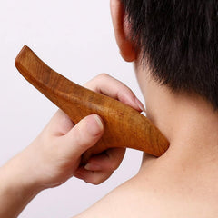Broman Triangle Massager arc edge targets larger surfaces for soothing strokes.