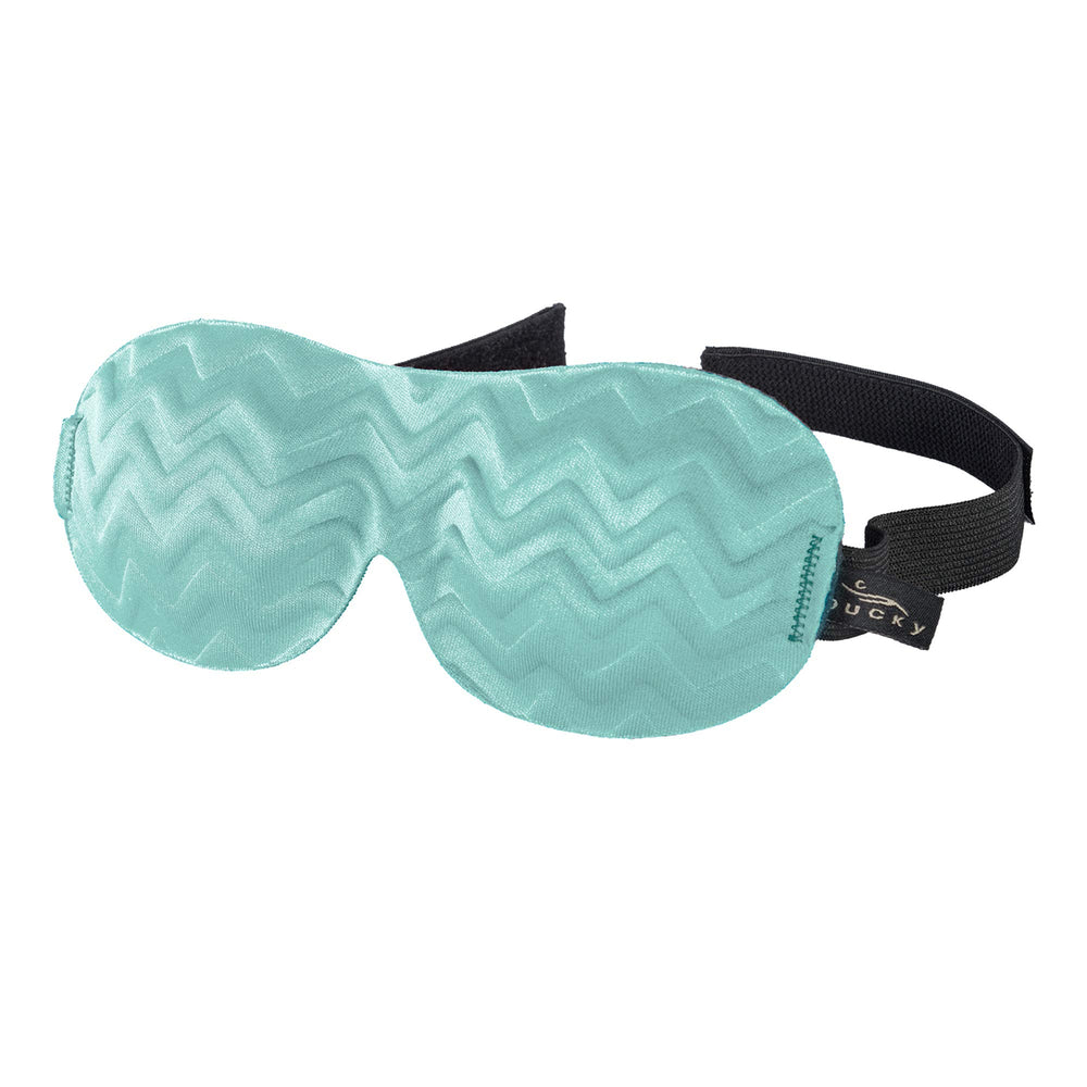 Bucky Ultralight Travel Eye Mask in Blue Ice blocks light for restful travel.