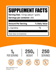 BulkSupplements L-Carnitine powder scoop shows precise 1 g servings for measurement.
