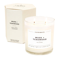 Calyan Musk Teakwood 2-Wick Candle in a glass jar for a warm, inviting ambiance.