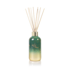 Capri Blue Glimmer diffuser bottle with amber glass for long-lasting room fragrance.