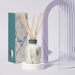 Capri Blue Modern Marble diffuser sticks shown with Volcano fragrance for even diffusion.