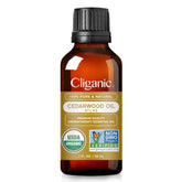Cliganic Cedarwood essential oil bottle for diffusion and calming ambiance.