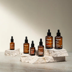 Cliganic cinnamon cassia oil bottle close-up shows purity and eco-friendly sourcing.