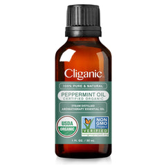 Cliganic Organic Peppermint Oil 1oz bottle in diffuser setup for a revitalizing scent.