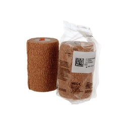 Coban 1584 self-adherent wrap in tan securing a dressing for reliable placement