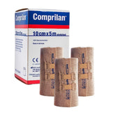 Comprilan 3-pack compression bandage rolls ready for clinical use