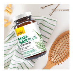 Country Life Maxi-Hair Plus bottle and capsules arranged for routine