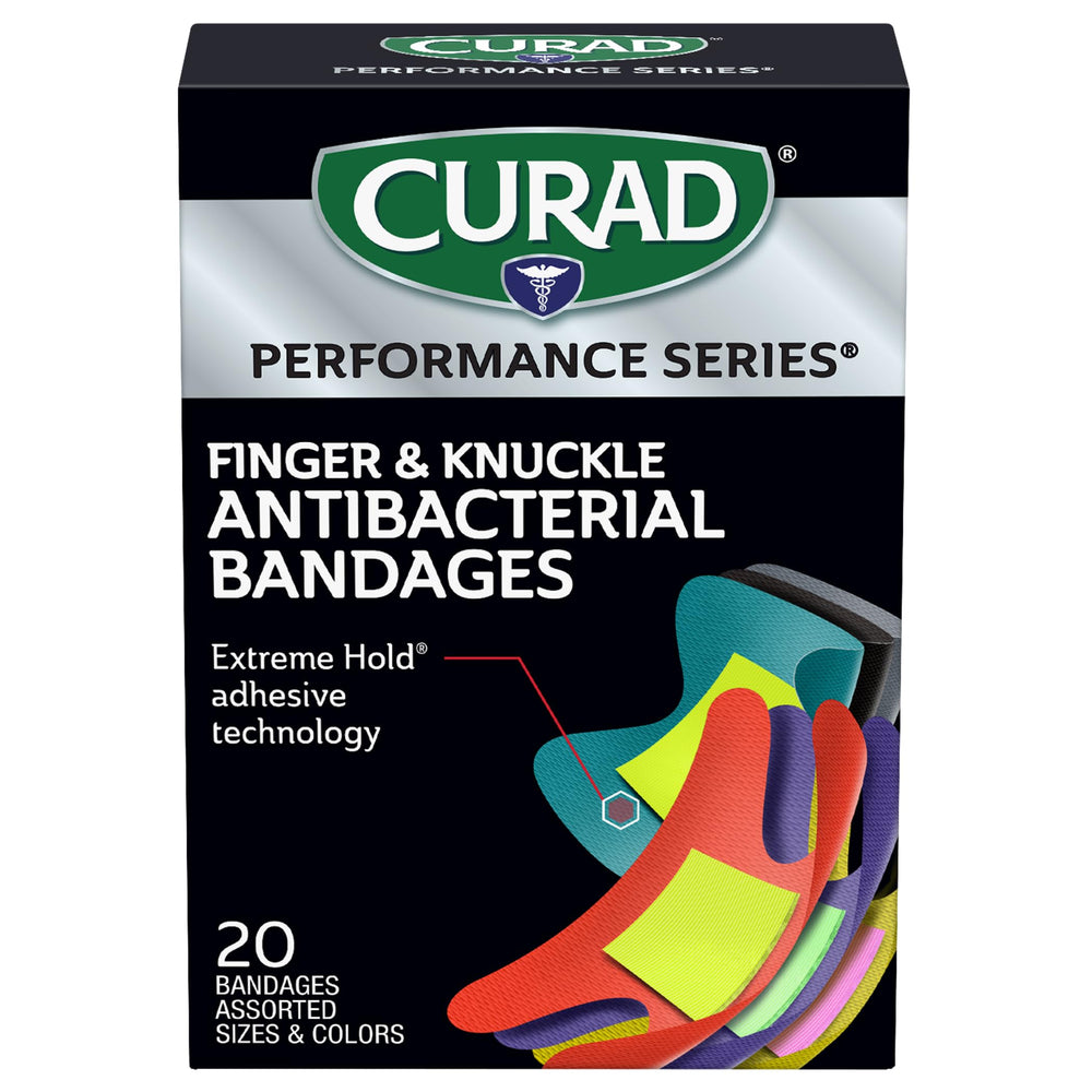 Curad Performance Series extreme-hold adhesive bandage securing a wrap during workouts